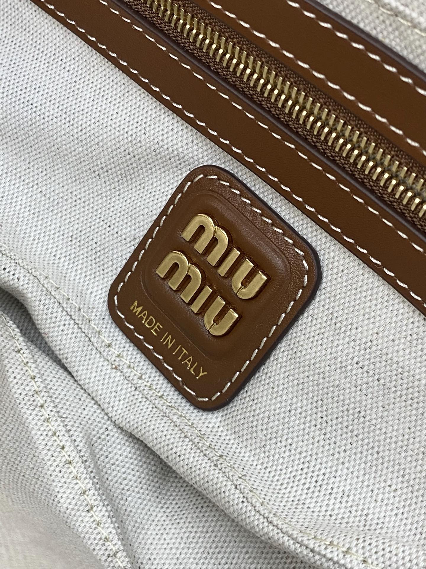 M1um1u beau top-handle tratan bag -27×12×9cm